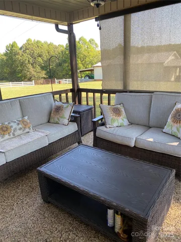 a kitchen with a table chairs stove and microwave