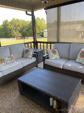 a kitchen with a table chairs stove and microwave