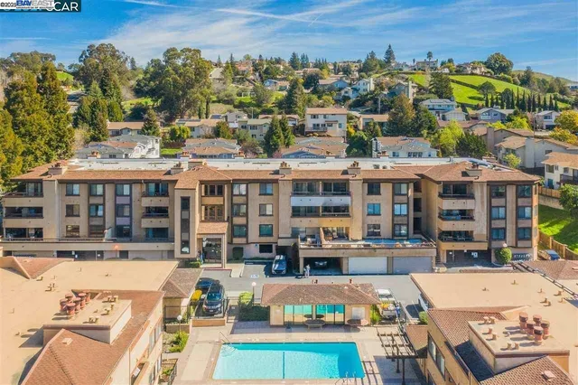 a view of a building with sitting area