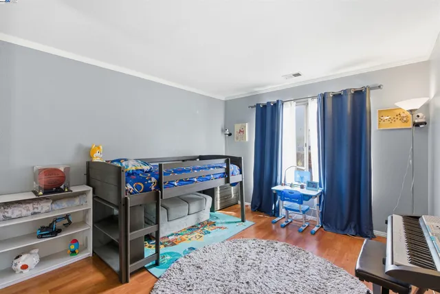 a bedroom with furniture and a window