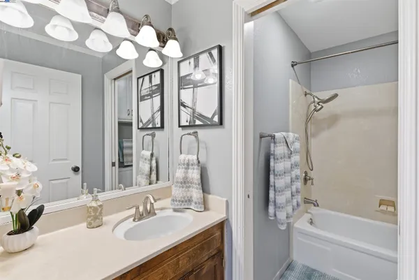a bathroom with a shower and a sink