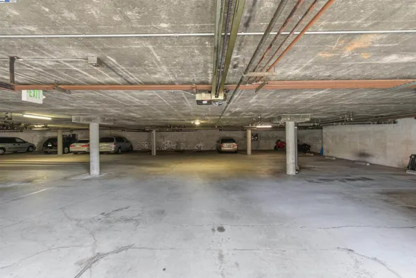 a front view of a building with parking