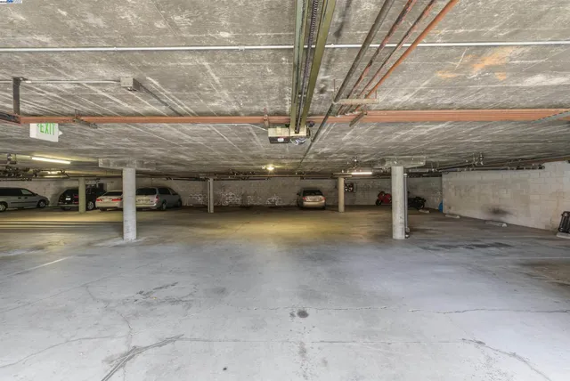 a front view of a building with parking