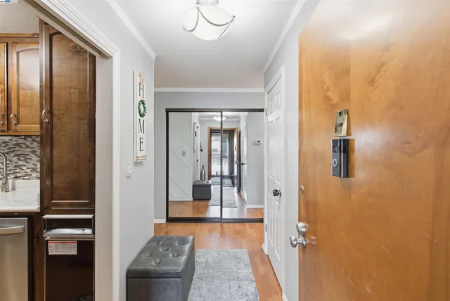 a view of a hallway with a living room