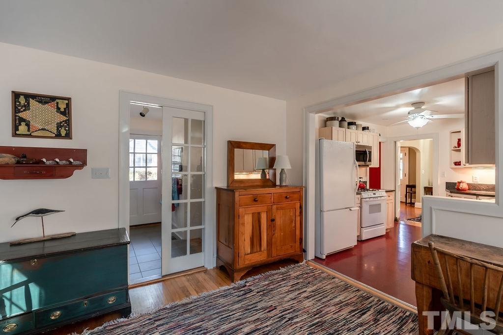 3203 Bedford Avenue Raleigh, NC 27607 - Photo 11 of 20 a living room with furniture and a wooden floor