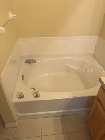 a bathroom with a sink a vanity and a mirror