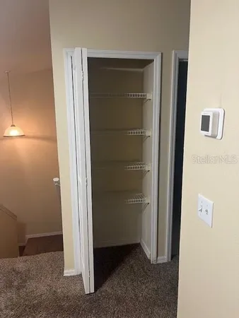an empty room with a bench