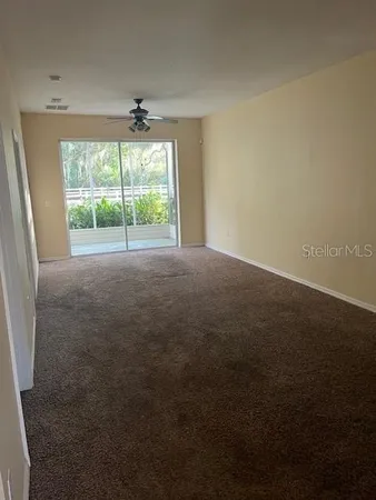a view of an empty room with a window