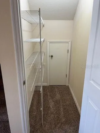 a view of a refrigerator in a kitchen