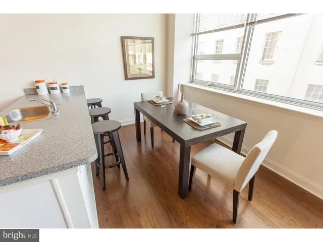 a view of a dining room with furniture and window