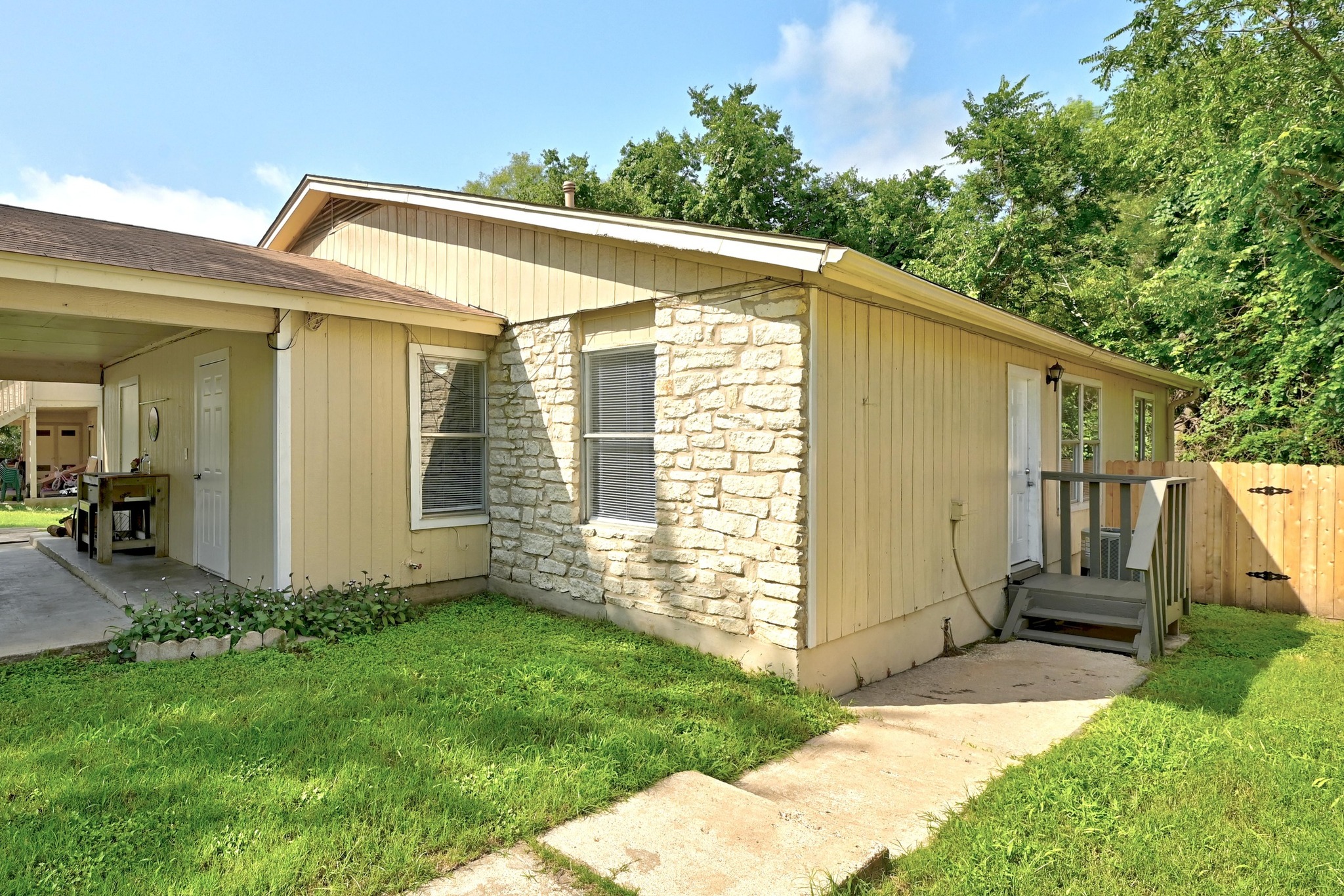 5707 Spring Meadow Road Austin, TX 78744 - Photo 4 of 21 a view of a house with backyard and garden