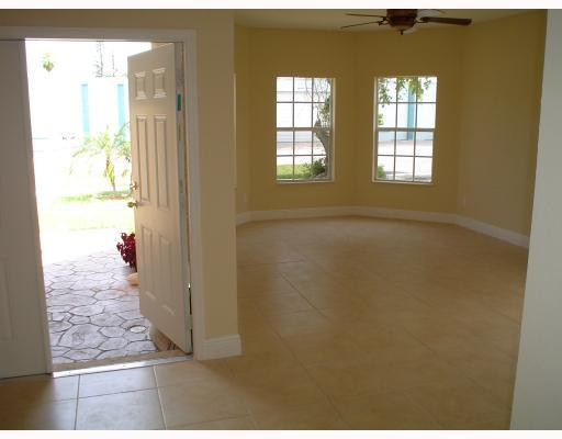 910 Phippen Waiters Road Dania Beach, FL 33004 - Photo 9 of 16 a view of an empty room and window