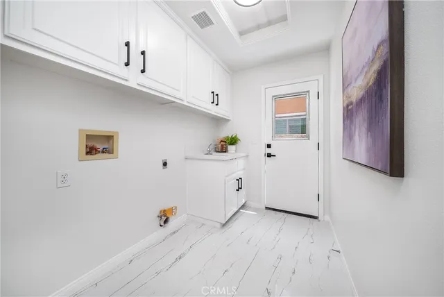 a bathroom with a sink mirror vanity and toilet