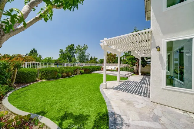 a view of a house with backyard and porch