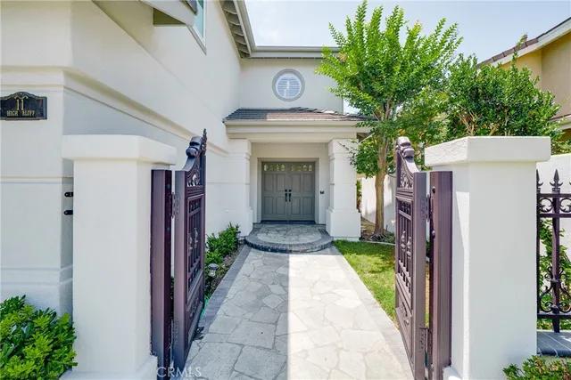 a living room with furniture and flowers