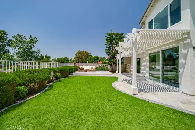 a front view of a house with porch and garden