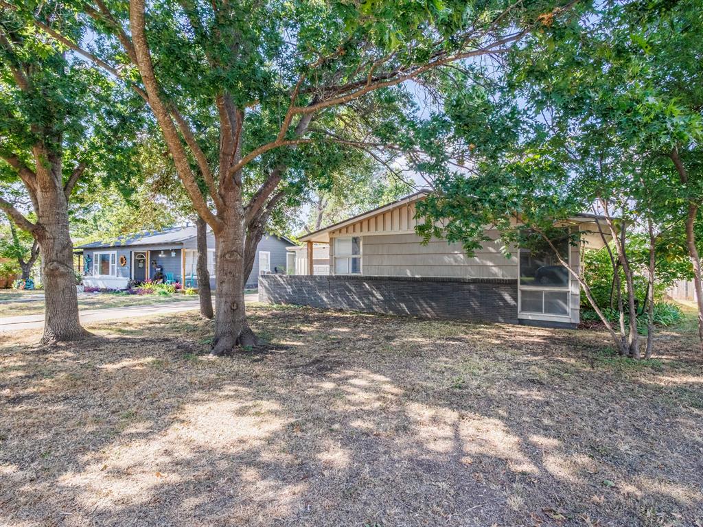 311 Miami Street Coleman, TX 76834 - Photo 2 of 31 a house with trees in front of it