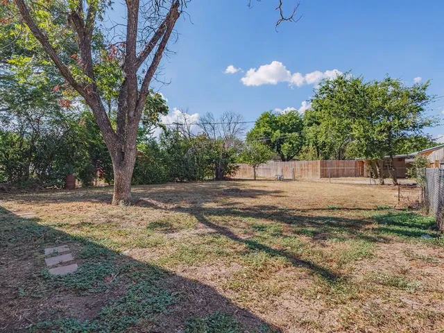 a view of backyard with green space
