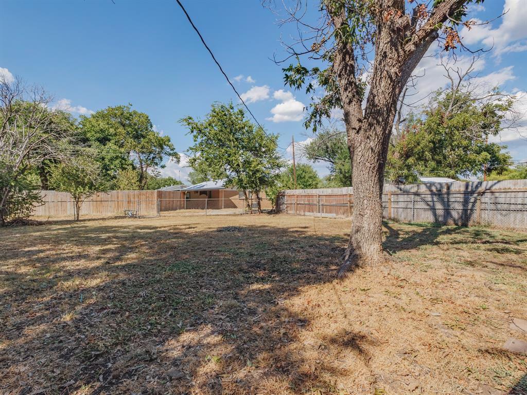 311 Miami Street Coleman, TX 76834 - Photo 25 of 31 a view of a yard with tree s