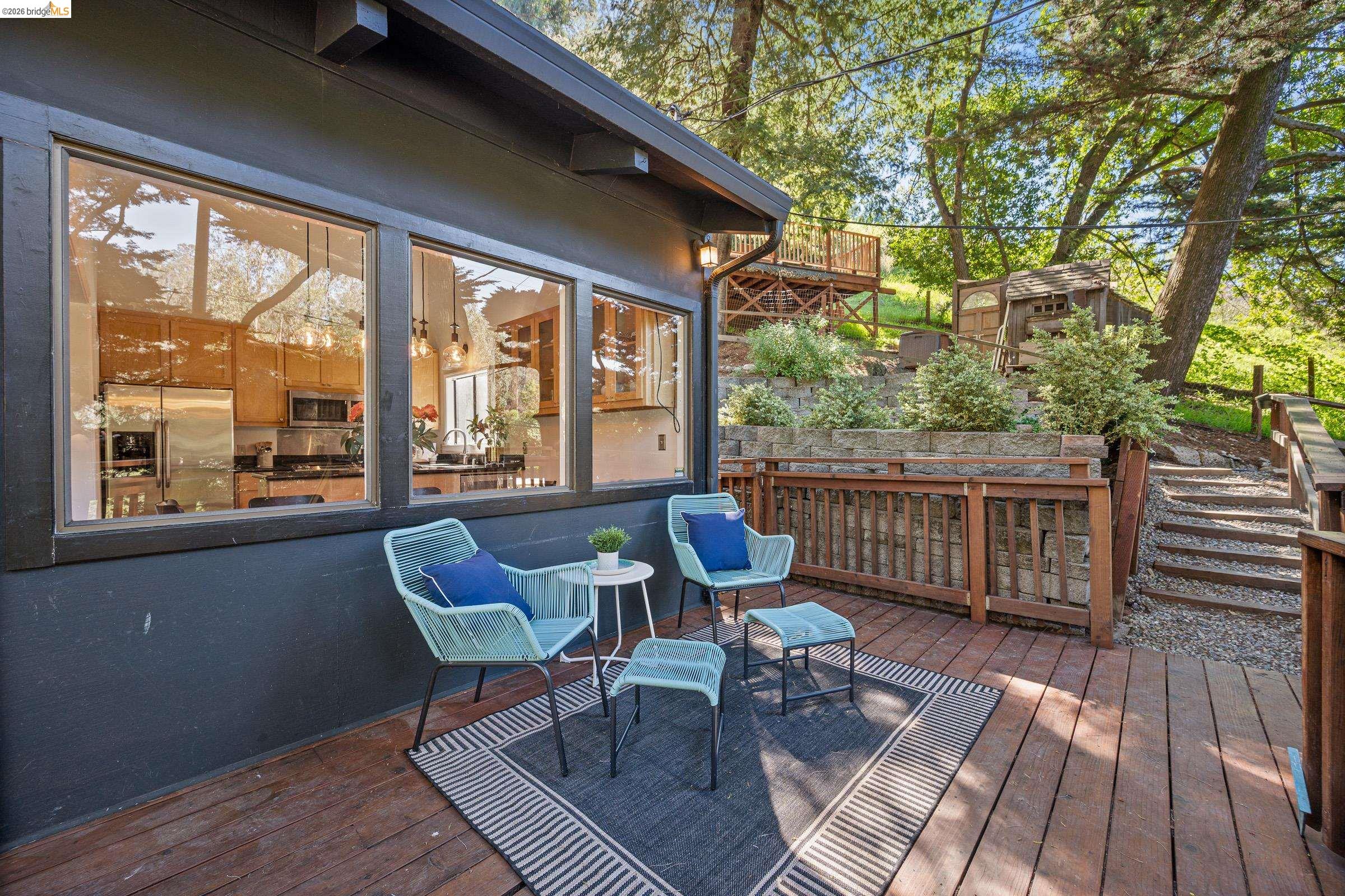 6600 Heather Ridge Way Oakland, CA 94611 - Photo 3 of 58 Wooden terrace featuring a storage unit