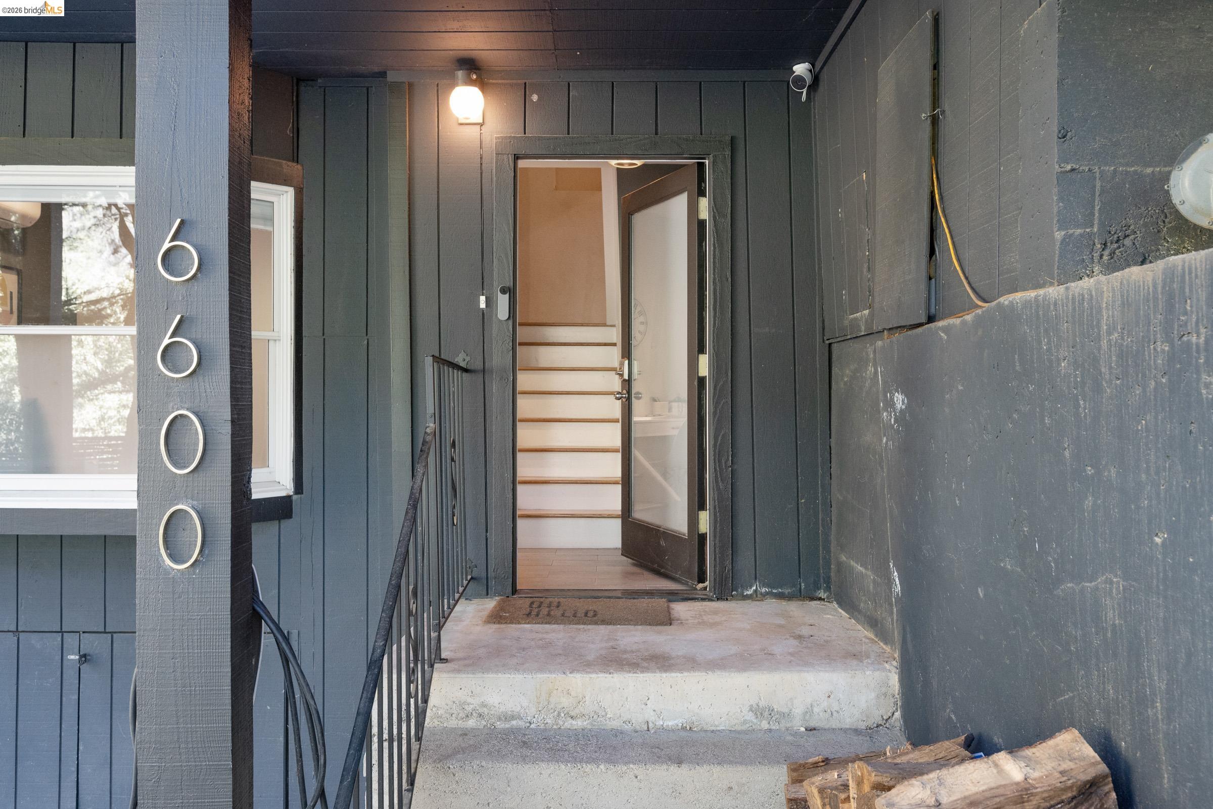 6600 Heather Ridge Way Oakland, CA 94611 - Photo 39 of 58 Property entrance with board and batten siding