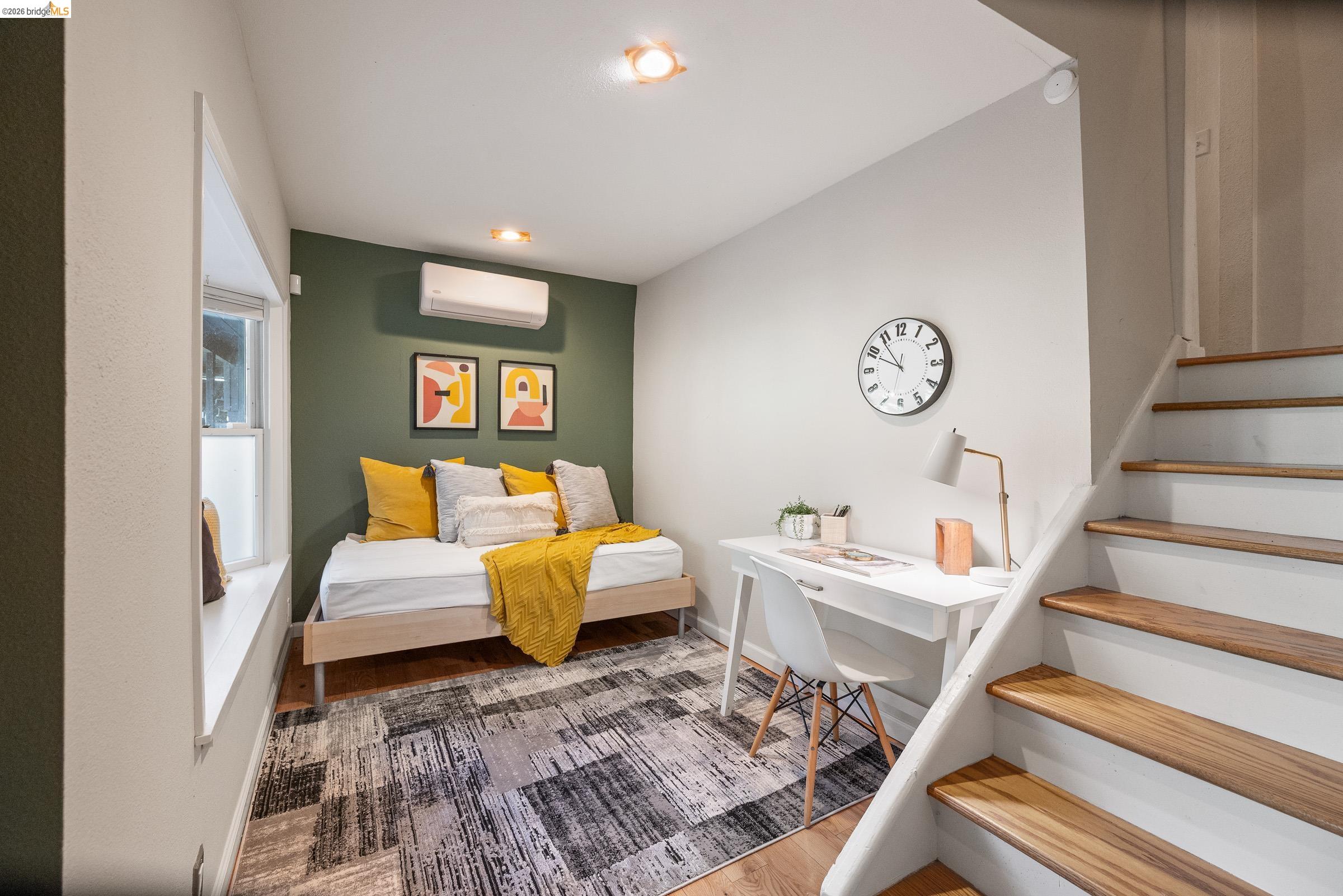 6600 Heather Ridge Way Oakland, CA 94611 - Photo 40 of 58 Bedroom with light wood-style floors and a mini split for heating / cooling