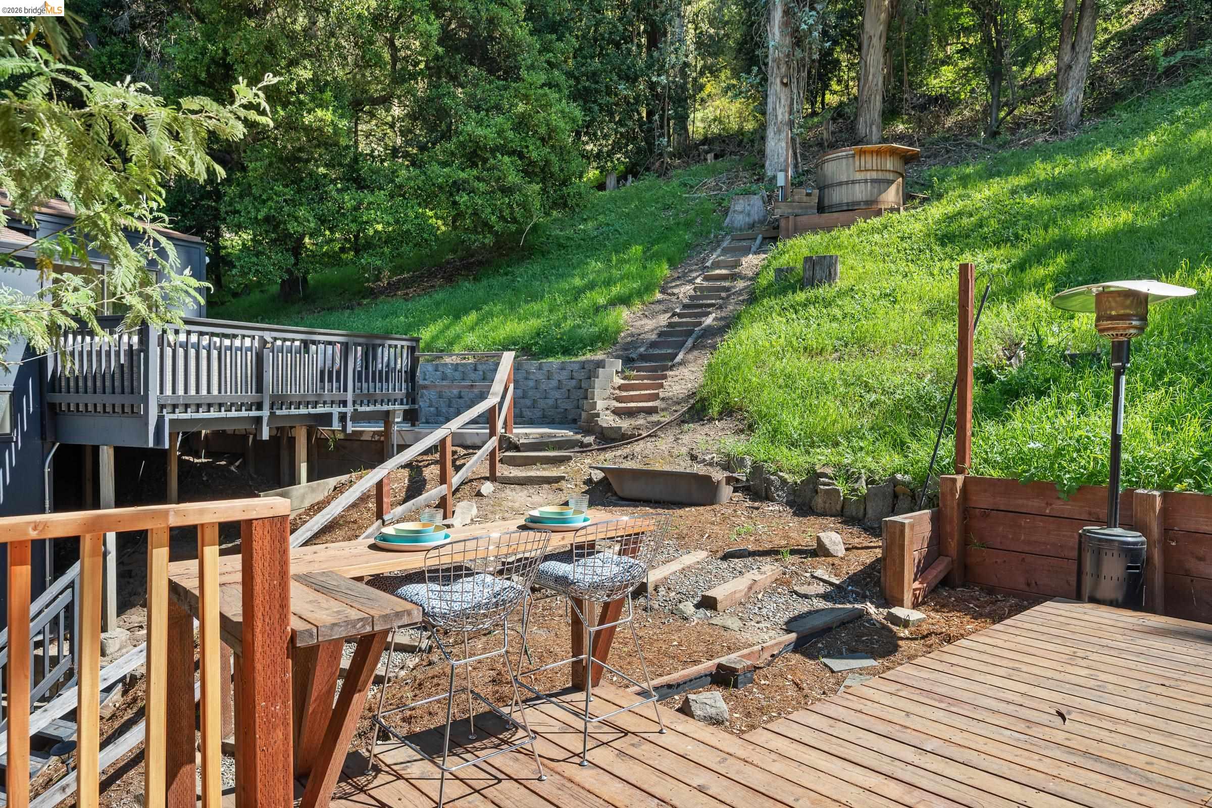 6600 Heather Ridge Way Oakland, CA 94611 - Photo 50 of 58 View of yard with stairway and a wooden deck