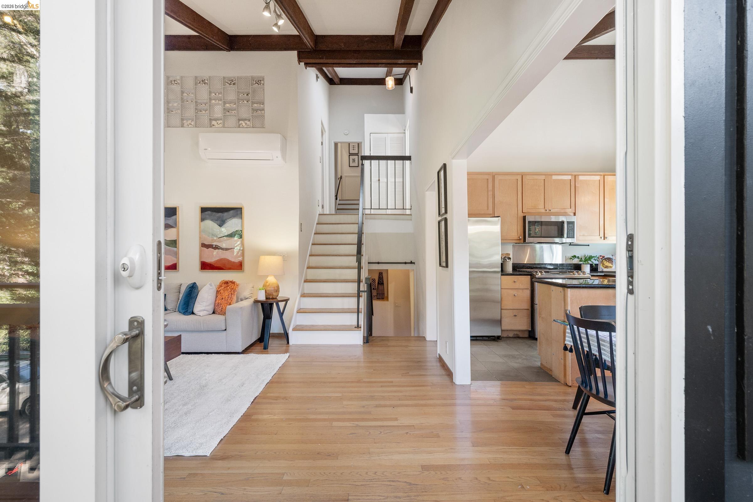 6600 Heather Ridge Way Oakland, CA 94611 - Photo 5 of 58 Entryway with light wood-style flooring and rail lighting