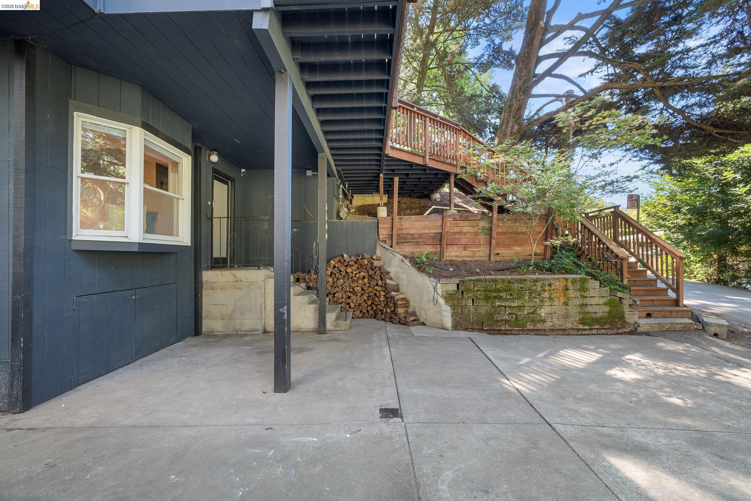 6600 Heather Ridge Way Oakland, CA 94611 - Photo 55 of 58 View of patio / terrace with stairs and a wooden deck