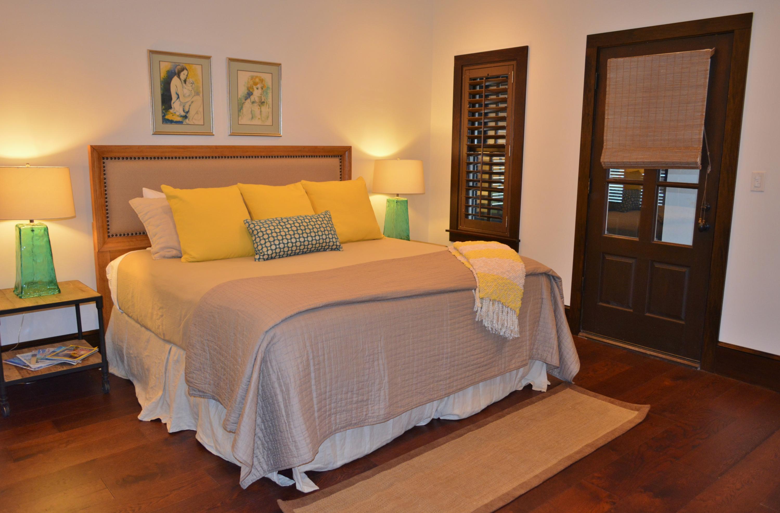 102 Round Road Rosemary Beach, FL 32461 - Photo 13 of 36 a bedroom with a bed and a night stand