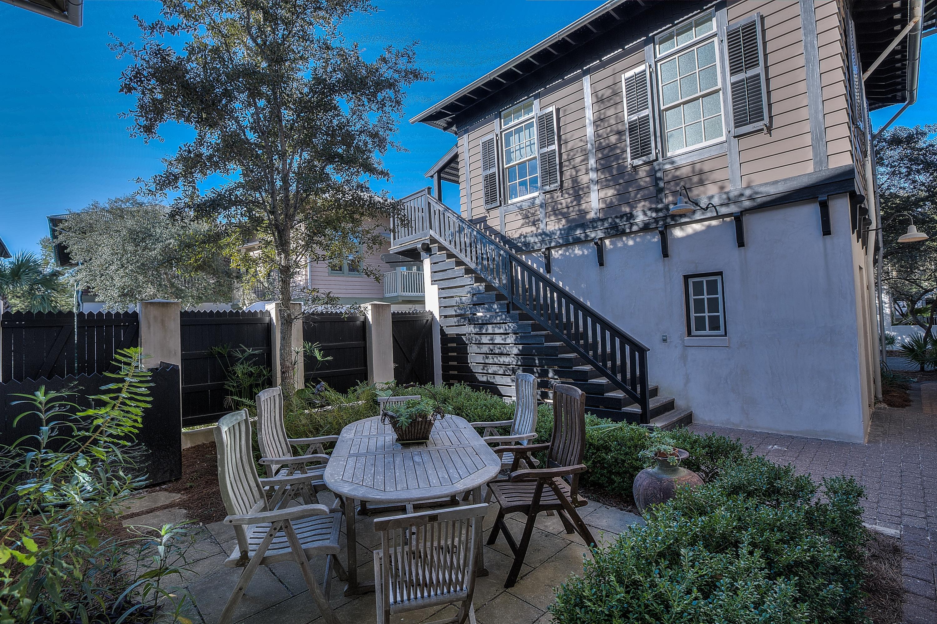 102 Round Road Rosemary Beach, FL 32461 - Photo 21 of 36 a view of a house with backyard and sitting area