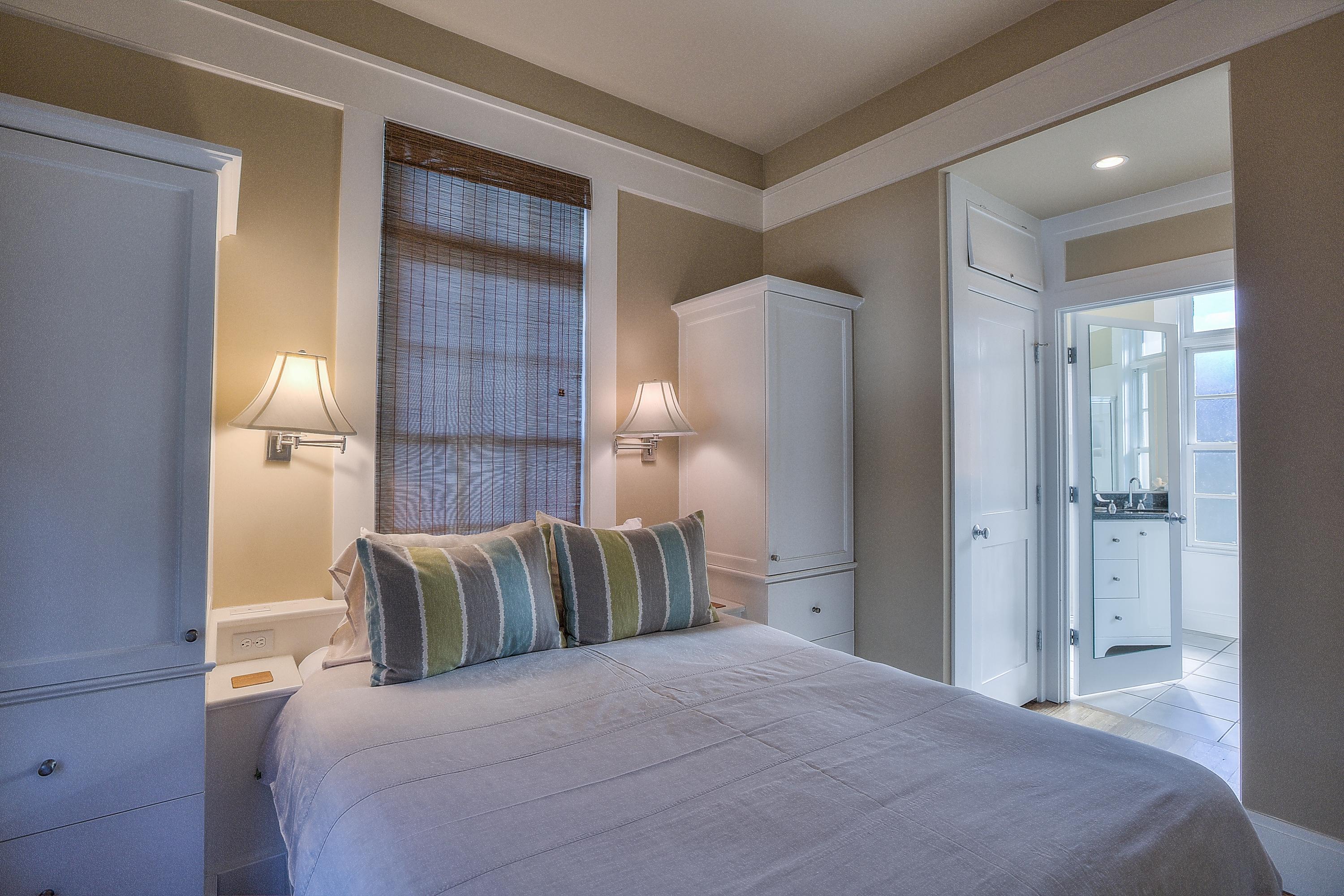 102 Round Road Rosemary Beach, FL 32461 - Photo 27 of 36 a bedroom with a bed and a mirror