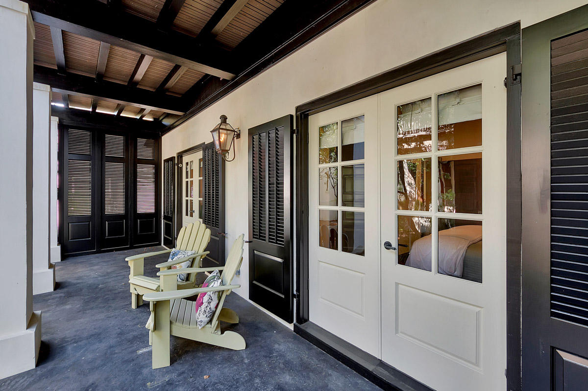 102 Round Road Rosemary Beach, FL 32461 - Photo 30 of 36 a view of a porch with chairs and entryway door