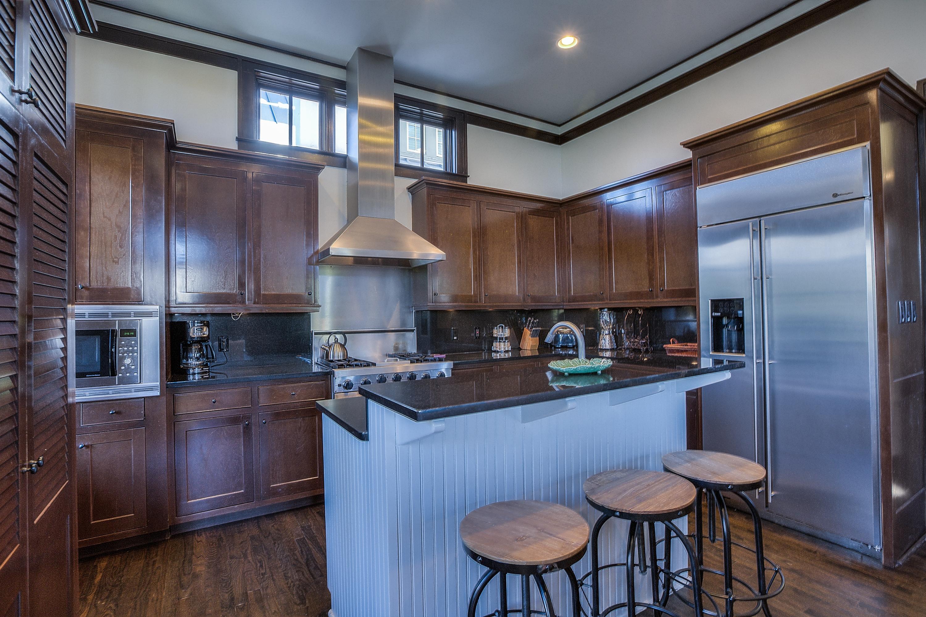 102 Round Road Rosemary Beach, FL 32461 - Photo 5 of 36 a kitchen with stainless steel appliances a sink a stove a refrigerator cabinets and dining table