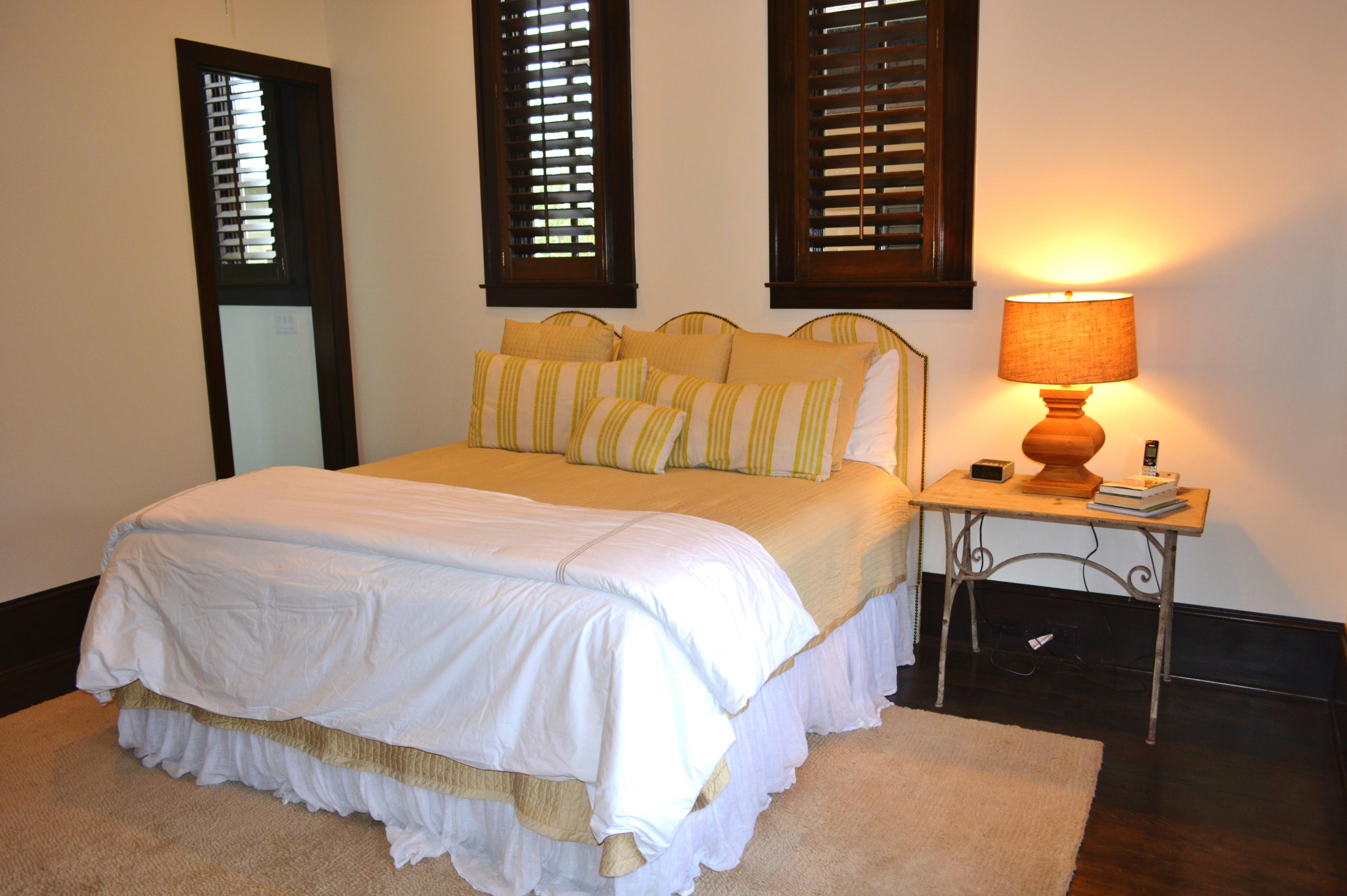 102 Round Road Rosemary Beach, FL 32461 - Photo 10 of 36 a bedroom with a bed and a night stand