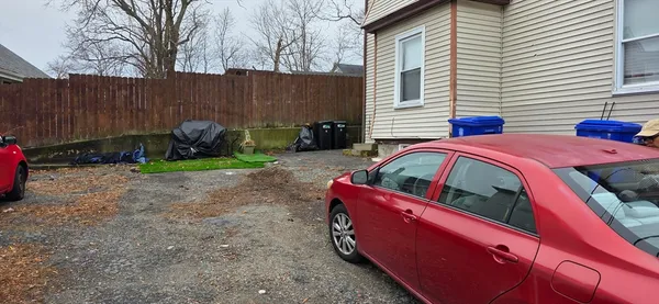 a view of a patio with a table and chairs
