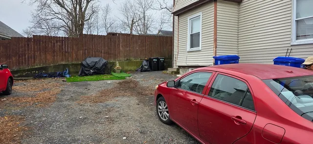 a view of a patio with a table and chairs