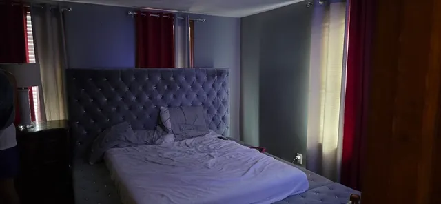 a bathroom with a shower and mirror