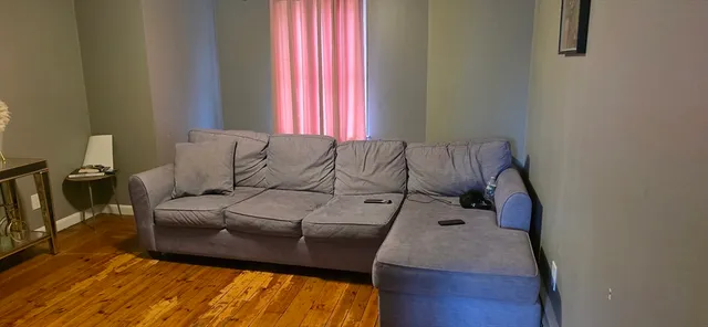 a view of a hallway with windows and closet