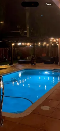 a view of a chairs and table in a patio