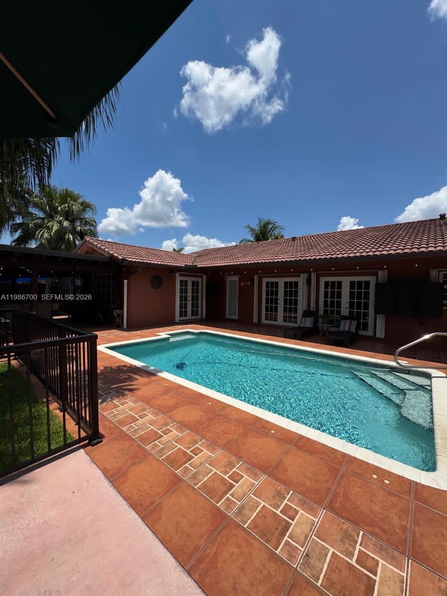 14620 Southwest 151st Terrace Miami, FL 33196 - Photo 26 of 30 a view of a house with a patio