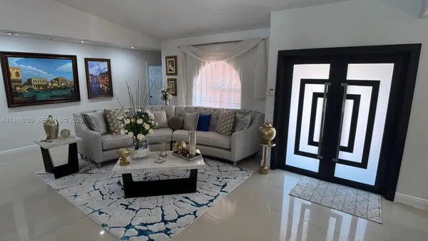 a view of a dining room with furniture and window