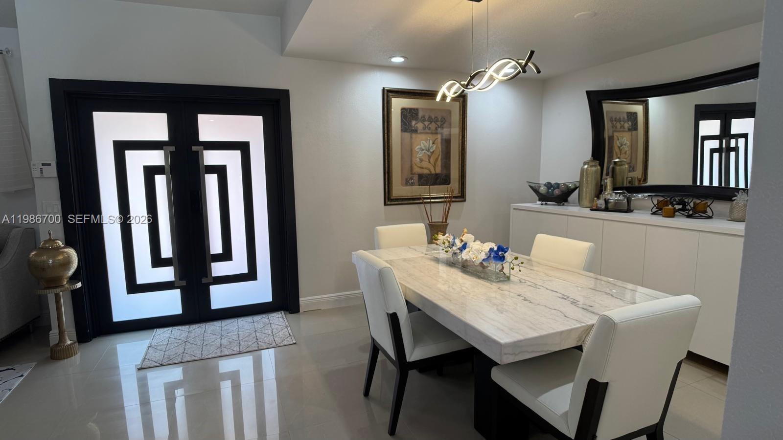 14620 Southwest 151st Terrace Miami, FL 33196 - Photo 4 of 30 a view of a dining room with furniture and window