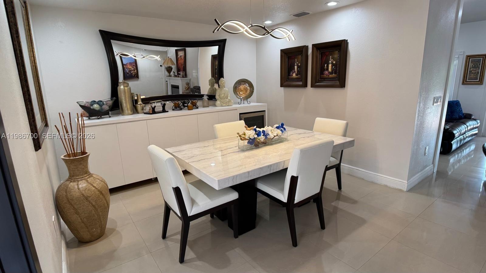 14620 Southwest 151st Terrace Miami, FL 33196 - Photo 5 of 30 a dining room with furniture and window