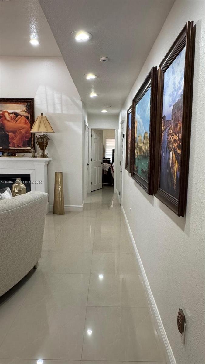 14620 Southwest 151st Terrace Miami, FL 33196 - Photo 6 of 30 a living room with furniture and a flat screen tv