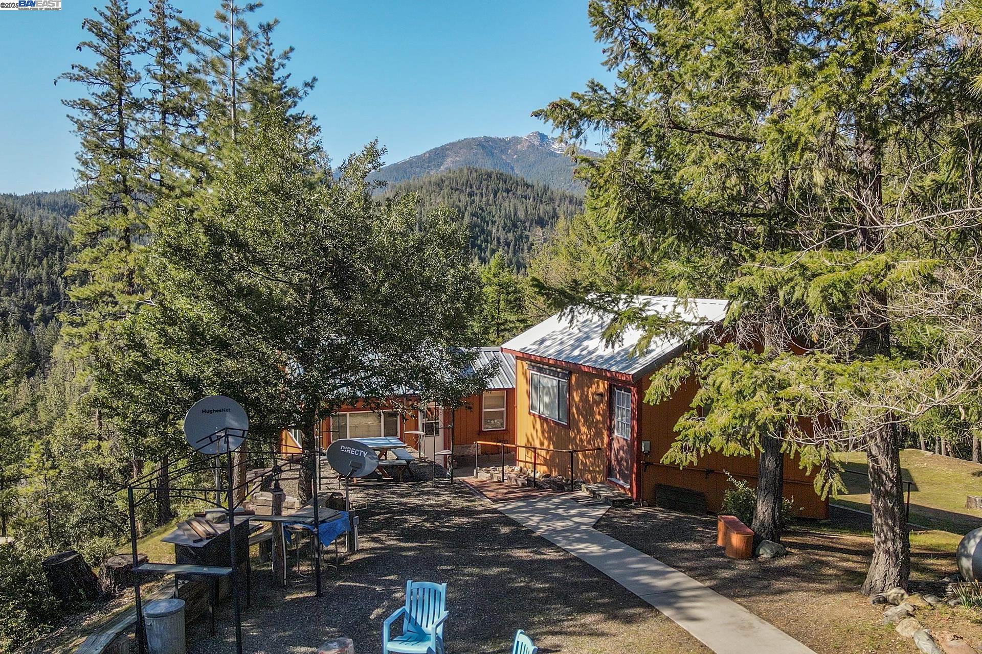 8341 East Side Road Trinity Center, CA 96091 - Photo 13 of 58 a front view of a building with trees
