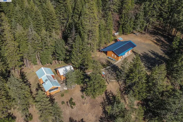 a kitchen with granite countertop a sink stove and refrigerator