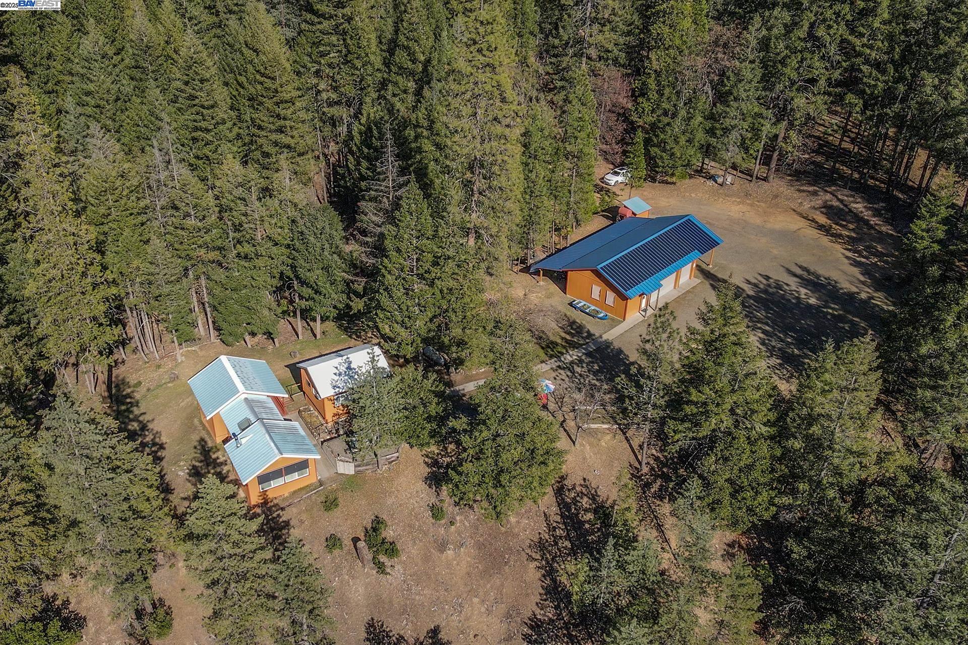 8341 East Side Road Trinity Center, CA 96091 - Photo 17 of 58 an aerial view of a house with a yard