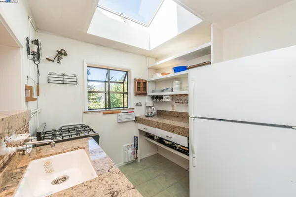 a bath room with a table and a clock