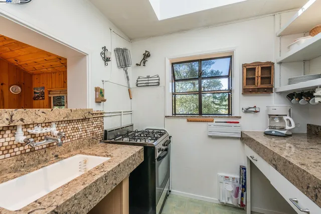 a bathroom with a sink a mirror and a window